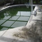 pool deck before pressure washing